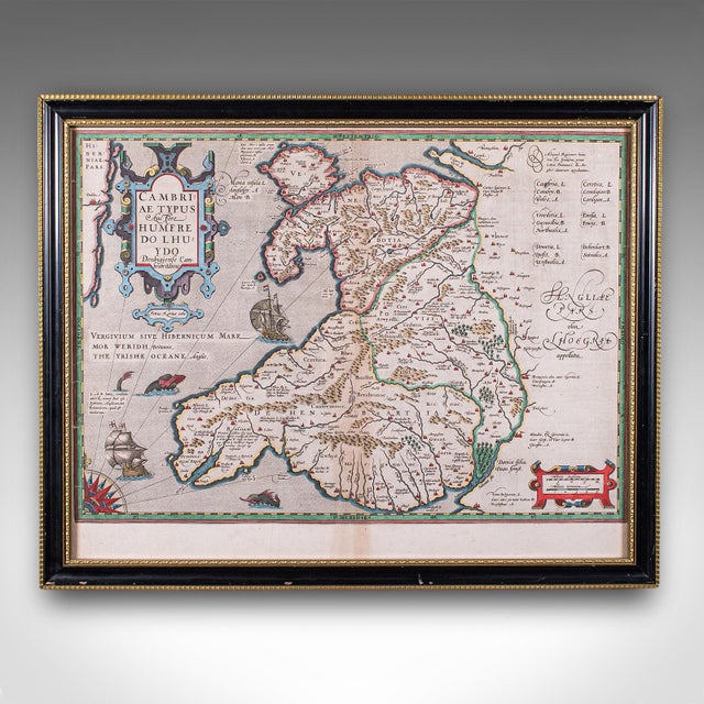 This is an antique map of Wales. A Belgian, framed atlas excerpt with dual sided mount, this example from the Theatrum...