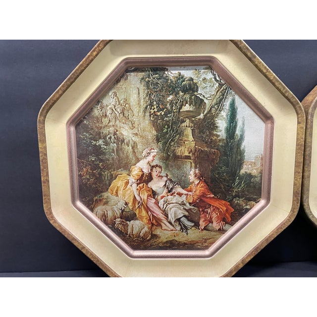 A pair of metal octagonal wall hangings with two Francois Boucher (1703-1770) "The Nest" and "The Charms of Country...