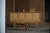 A refined Danish Mid-Century sideboard in oak, in the style of Henning (Henry) Kjærnulf, crafted by a skilled Danish...