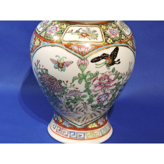 This large hand painted Chinoiserie Chinese Familee Rose ginger jar was made by the Lotus Brand Co. from the Macau region...