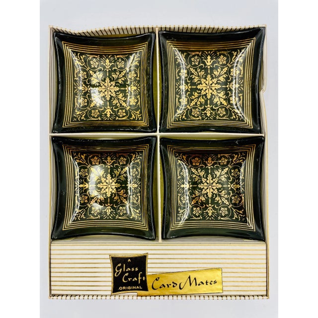 These pristine and never used set of 4 smoke glass petite trays are not only beautiful, but they are mid-century history...