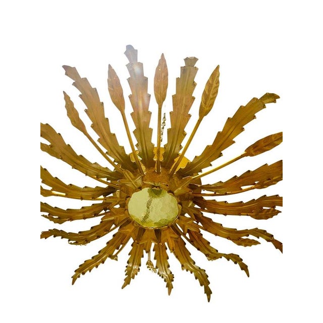 Large Spanish sunburst light in gilt metal and frosted glass,greeen ; white ; orange, other color Spain, 1950s. Midcentury...