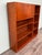 Italian-made bookcase produced in the 1960s. Made of teak veneer. Comprising shelves and a compartment closed by two small...