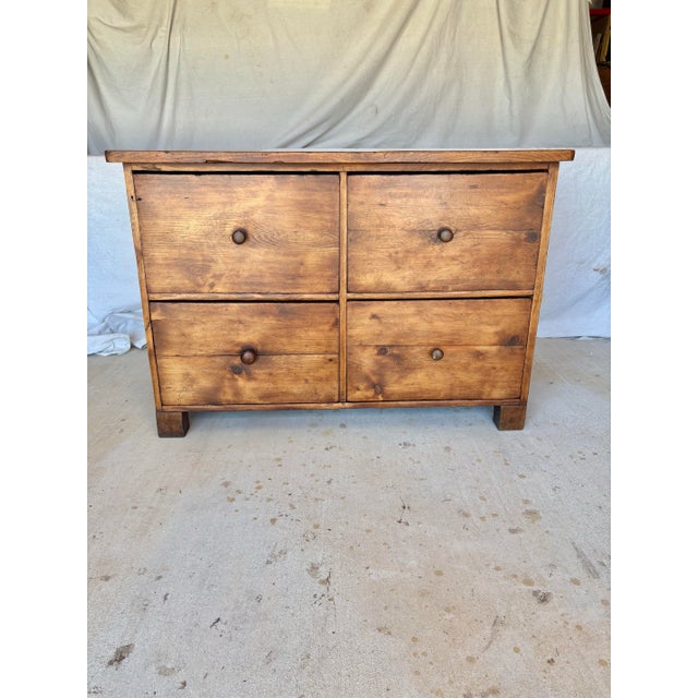Found in the South of France, this 20th Century French Pine Four Drawer Chest dates back to the early 1900's. The piece...