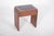 Piano bench. with a simple, solid rectangular structure, it reflects a functional aesthetic characteristic of mid-20th...