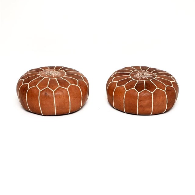 A gorgeous pair of vintage Moroccan leather ottoman stools. They were hand made in Morocco, they date from around the...