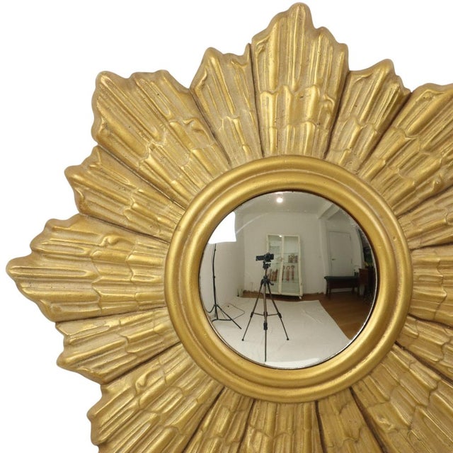 Vintage sunburst mirror made of plaster—a rare example in this material—featuring a convex mirror set at the front; made...