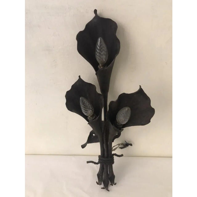 Rare wall sconce attributed to Mazzucotelli wrought iron craftsman in Milan in the early twentieth century. The lamp was...