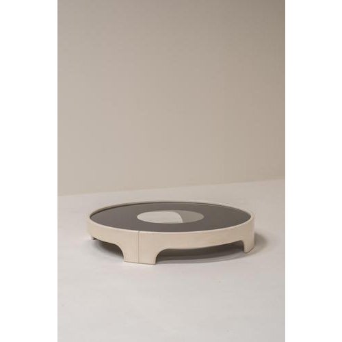 Elegant and sculptural coffee table designed by Tito Agnoli, showcasing a refined balance between soft curves and...