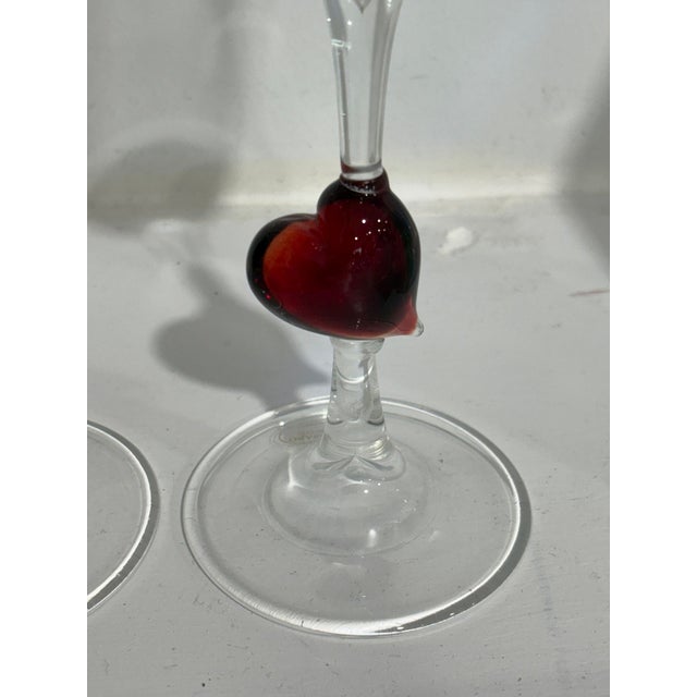These lovely glass flutes feature a red heart. Made in Murano, and in new condition! Price is for the pair.