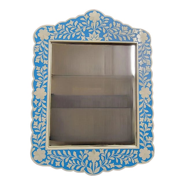 A stunning wall mirror from Butler’s Vivienne Collection featuring botanic patterns created from white bone inlays cut and...