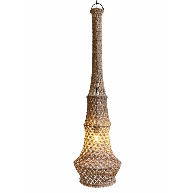 Impressive hand knotted macrame pendant light in a soft taupe color. Wonderful in groupings of different sizes or on its...