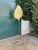 Tall brass standing lamp with a hammer leaf motif shade attributed to Tommaso Barbi for Bottega Gadda, Italy. The lamp is...