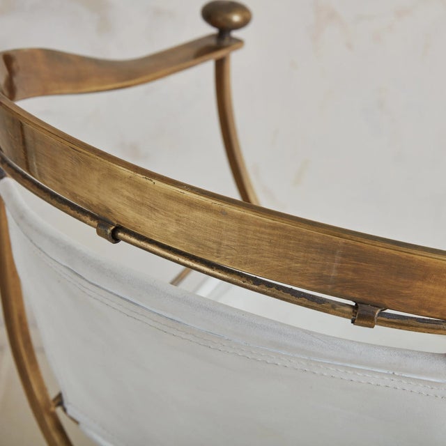 A rare white leather and brass ‘Pompeii’ armchair designed by Italian designer Alberto Orlandi. This Neoclassical chair...