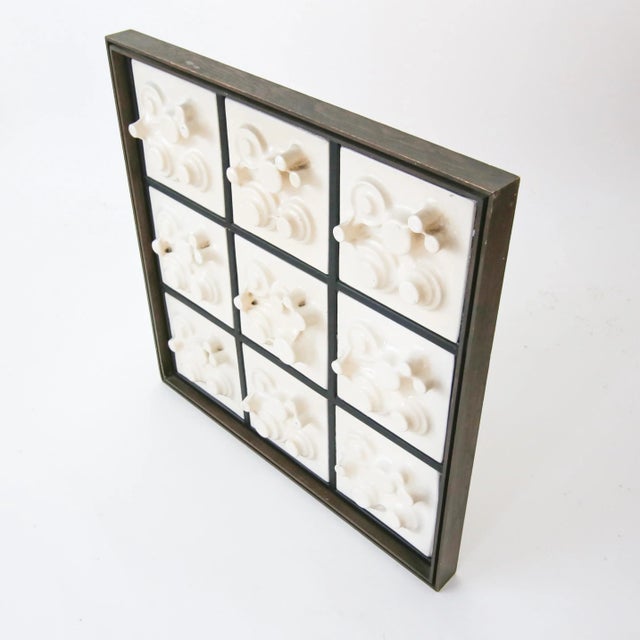 Funky brutalist wall sculpture made from vacuum formed plastic and wood. Artist unknown.