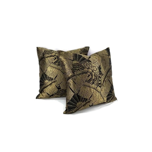 From Ralph Lauren is Coco De Mer in Tarnished Gold Pillow Cover. The fabric is embroidered in gold silk threads in a palm...