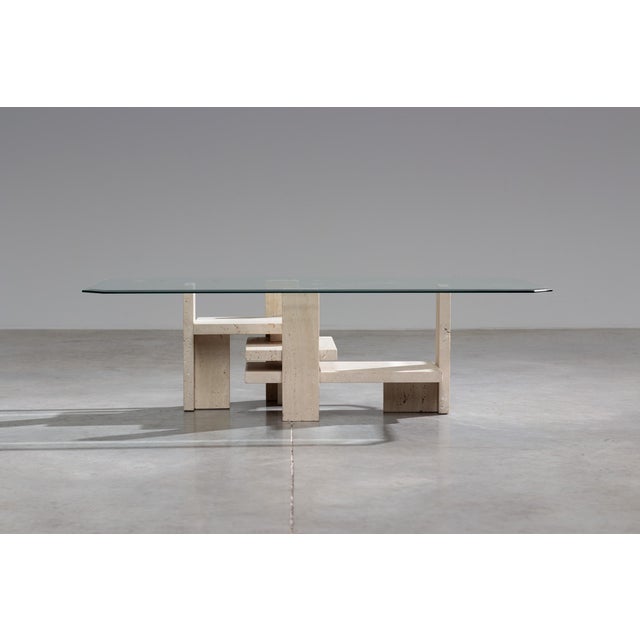 Coffee table designed by Willy Ballez. Circa 1970 Belgium. Travertine architectural base. Built up of horizontal and...