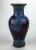 Early 20th Century Chinese vase covered with a crackle-suffused lavender-blue glaze splashed with deep purplish-red...