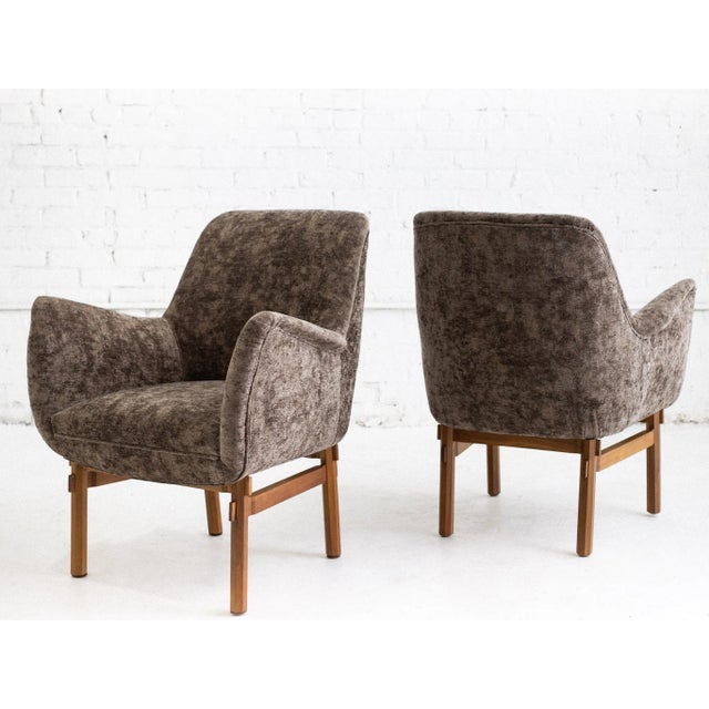 A pair of mid century Italian armchairs attributed to Ico Parisi for Cassina. Recently reupholstered in a mocha colored...