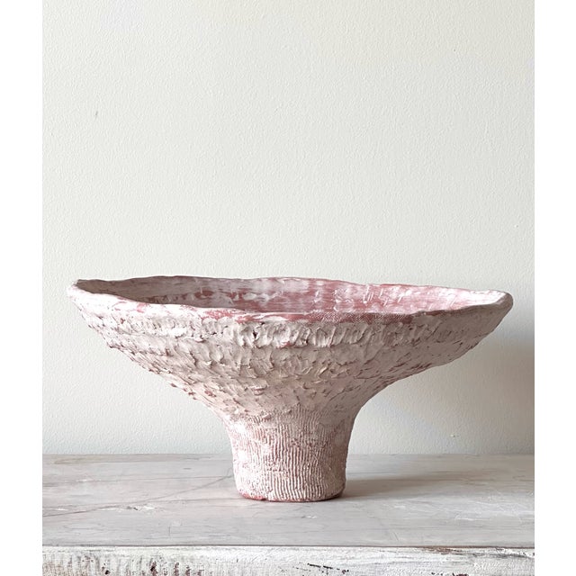BOWL - ALBA terracotta with underglaze Wide and low, balanced on a single pedestal foot. The form spreads outward like...
