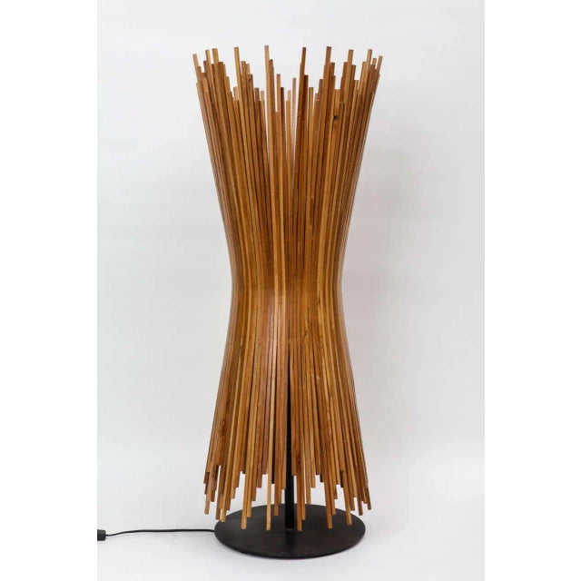 This Danish table lamp is comprised of wooden sticks and was produced in the 1960s. European Plug (up to 250V).The wiring...