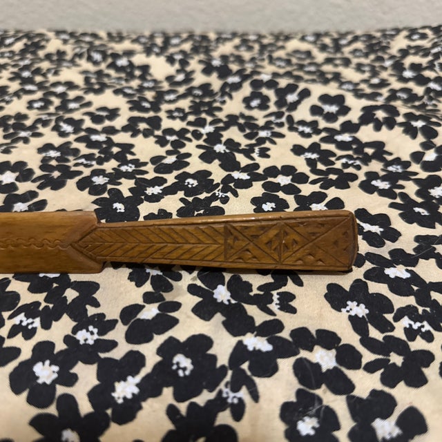 This vintage hand-carved wooden letter opener is a fine example of mid-century folk art from the former Yugoslavia....