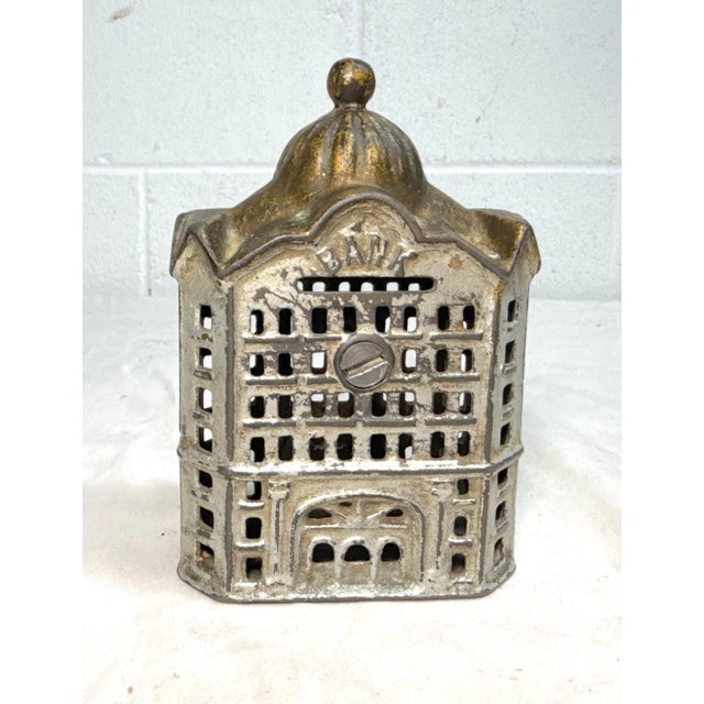 This Antique A.C. Williams cast Iron still bank is a unique and collectible piece made in Ohio during the early 1900s to...