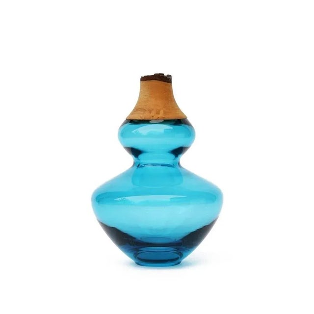 Aqua inanna stacking vessel, pia wüstenberg dimensions: d 14.5 x h 22 materials: glass, wood available in other colors....