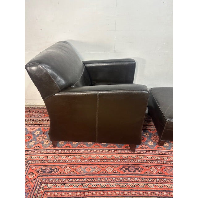 This Bradington-Young leather armchair and matching ottoman is an easy “anchor piece” for a living room, den, or...