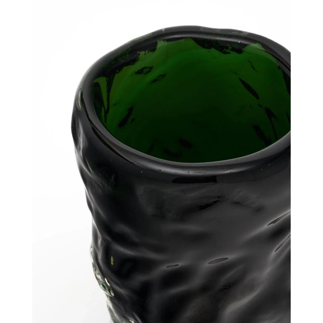 Single vase from the Island of Murano outside of Venice, Italy. It is hand blown in a deep green and clear colored glass....