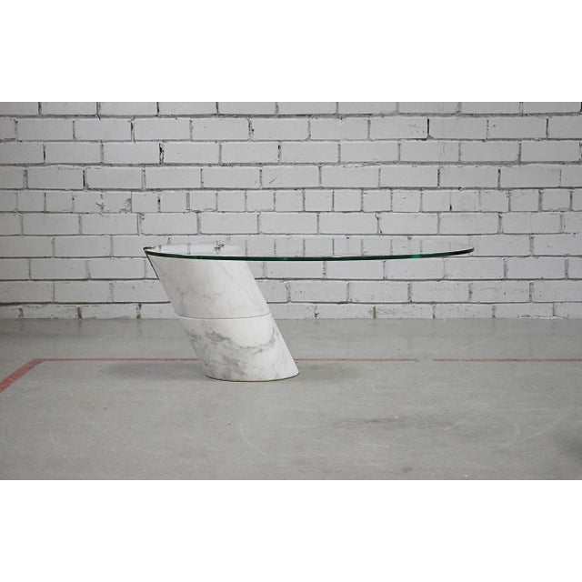 Vintage design coffee table by Ronald Schmitt, model K1000, 1970s. Thick glass table top with Carrara marble base....