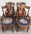 This is a gorgeous full set of four antique Victorian Eastlake-style walnut and needlepoint dining armchairs, circa late...