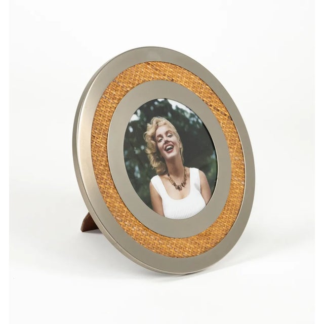 Midcentury wonderful round picture frame in steel, wood, wicker and glass by Tommaso Barbi. Made in Italy in the 1970s....