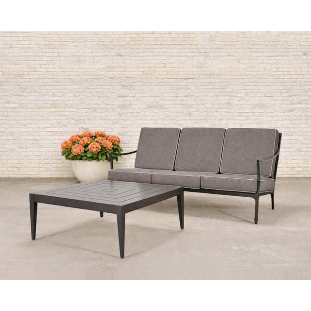 A handsome McKinnon and Harris outdoor three-seat sofa constructed out of performance aluminum. The "Beaufort" sofa is...