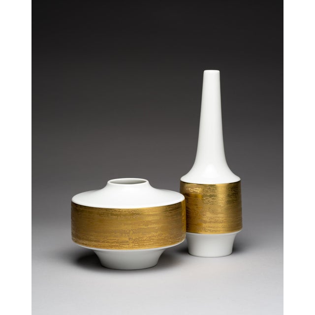 Matched pair of mid-century porcelain vases produced by Heinrich Selb Bavaria during the 1960s. The glossy white bodies...