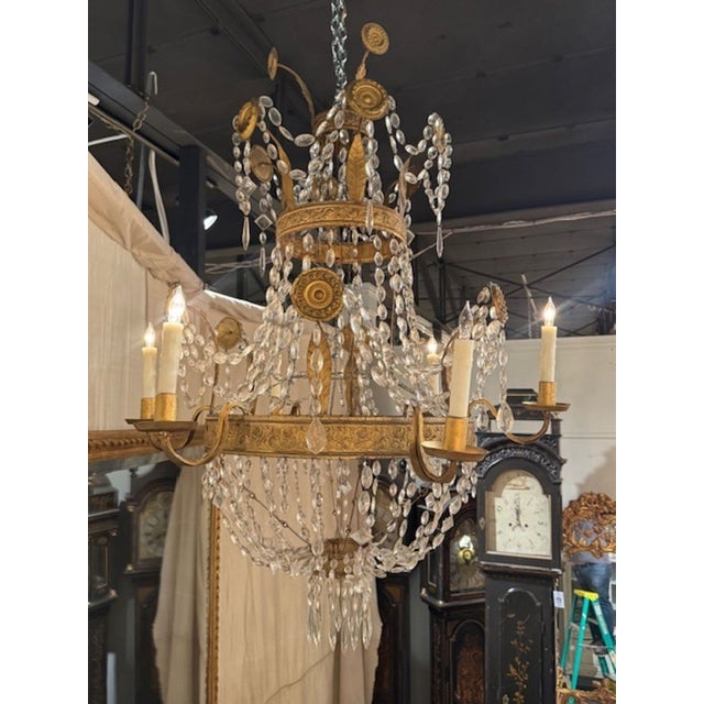 19th century Italian gilt tole and crystal basket chandelier from Tuscany. This chandelier is wired and ready to go. Circa...