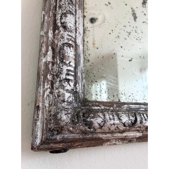An authentic antique French Louis Philippe mirror, dating to the late 19th century. This mirror has its original carved...