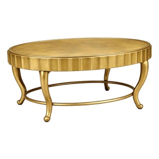 Vintage Hollywood Regency Oval Coffee Table by Decca With Fluted Apron and Ring Stretche For Sale