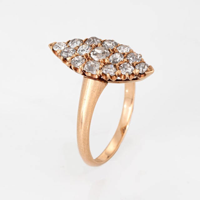 Stylish antique Victorian diamond navette ring (circa 1880s to 1900s) crafted in 14 karat yellow gold. 15 old mine cut...