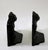 Wonderful cast iron bookends of a cat that also looks like a bat with the background the way it is. These are unmarked so...