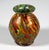 Mould-blown, bulbous body on a ring base, with a flared rim created by a constriction at the neck; colourless glass with a...