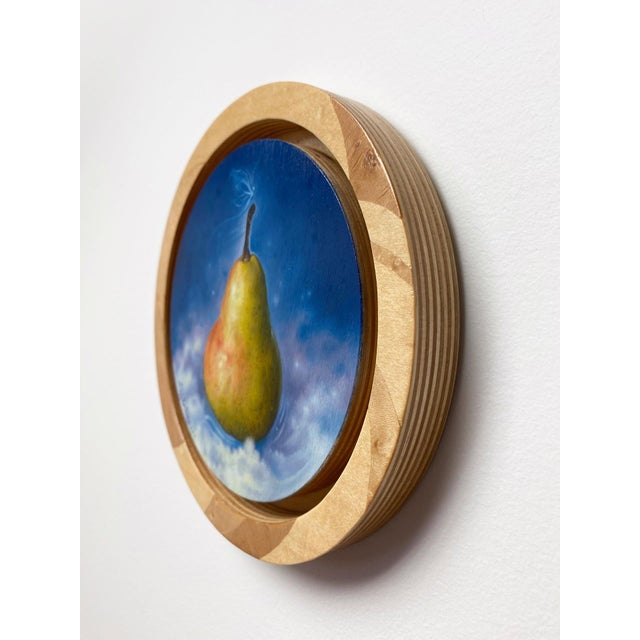 This oil painting on wood panel features a solitary pear, beautifully rendered against a deep blue background that evokes...