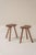Beautiful pair of minimalist wooden stools from France, dating back to the 1950s. These stools feature softly organic...