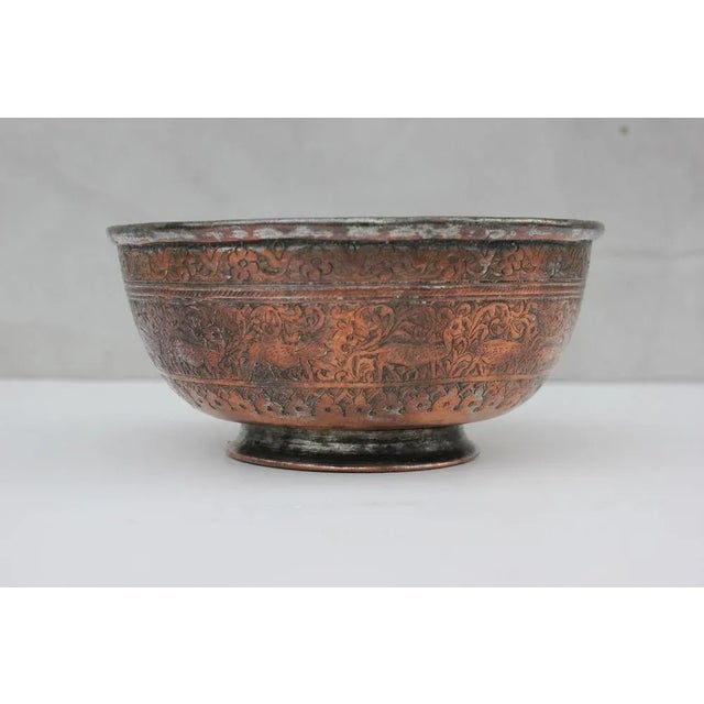 Amazingly masterful performance. Hand and relief engraved copper bowl. The whole area is decorated with borders of flowers...