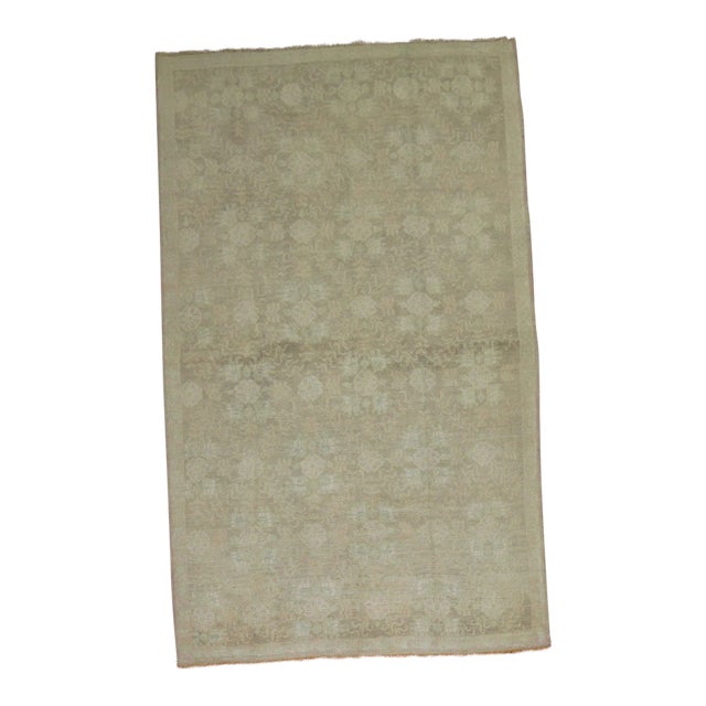 Pale Colors highlight this vintage turkish rug with an all-over floral design. circa mid 20th century