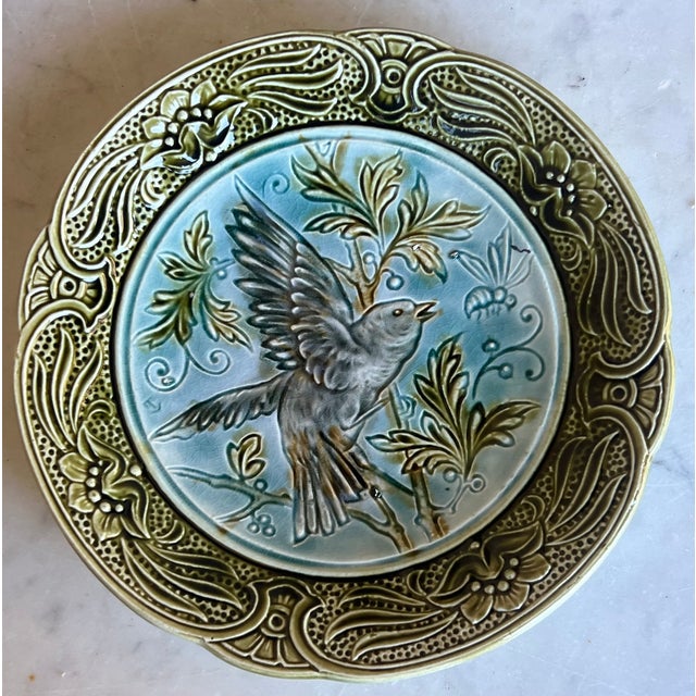 Art nouveau style plate made in Belgium by Wasmuel in the late 19th century. The hand painted plate features a bird and bee.