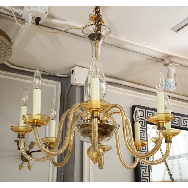 Amber eight-arm Murano glass chandelier.