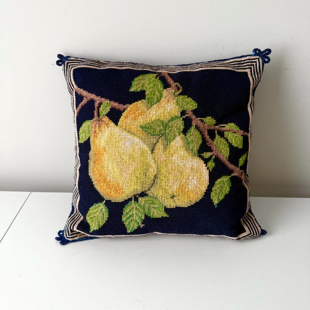 Vintage pear needlepoint wool throw pillow with insert. The pillow is unique with its carpet beater corner trim accents....