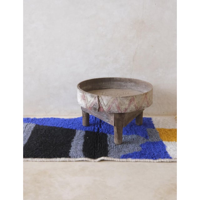 Add a touch of whimsy to your space with this Small Moroccan Handknotted Wool Rug. Measuring at 3.7 x 1.8 ft, this tiny...