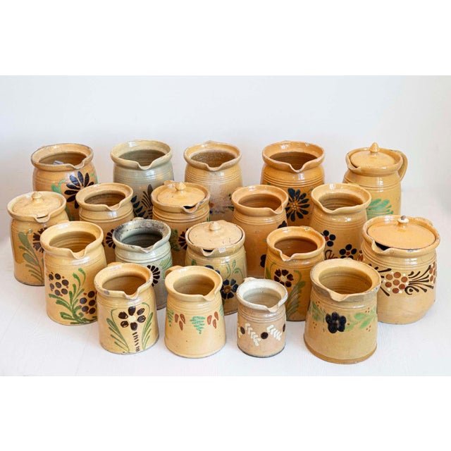 French terracotta pottery pitchers from the 19th century, with floral decor. We currently have a great selection of 19...